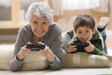 Grandmother and grandson playing video game