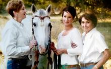 Mandy Sullivan and family posing with horse
